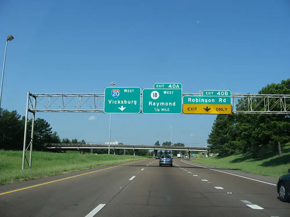American sign which says miles and has the American interstate symbol.